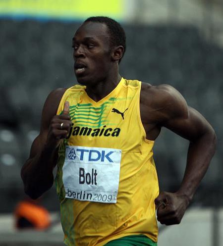 Usain Bolt of Jamaica competes in the heats of men's 200M in the 12th IAAF World Championships in Athletics in Berlin, Germany, Aug. 18, 2009. Usain Bolt is qualified to the next round with 20.70 seconds.