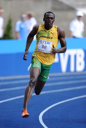 Usain Bolt of Jamaica competes in the heats of men's 200M in the 12th IAAF World Championships in Athletics in Berlin, Germany, Aug. 18, 2009. Usain Bolt is qualified to the next round with 20.70 seconds.