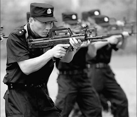 Police from Huaibei Public Security Bureau, Anhui province, take part in an exercise on Friday at a training camp where they improved their readiness ahead of October's 60th anniversary of the founding of New China.   