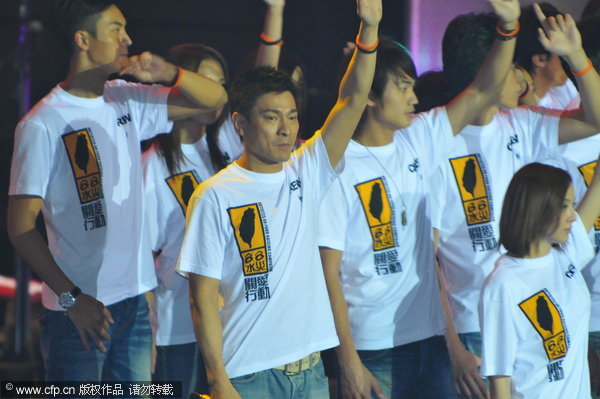 Hong Kong entertainer Andy Lau performed with other artists for the 'Artistes 88 Fund Raising Campaign' at the AsiaWorld-Expo in Hong Kong Monday, Aug. 17, 2009.