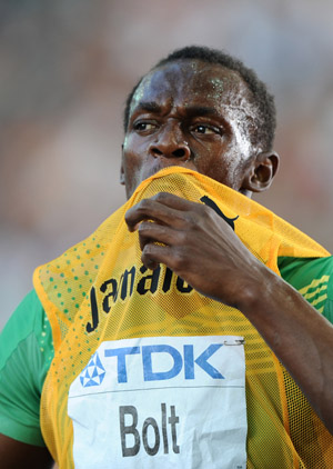 Jamaica's Usain Bolt celebrates after winning the men's 200m semi-final race of the 2009 IAAF Athletics World Championships on August 19, 2009 in Berlin. Bolt cruised into the final with ease in a score of 20.08 seconds. (Xinhua/Wu Wei)