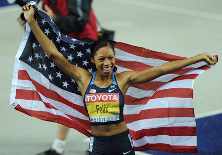 American Allyson Felix celebrates her victory in women's 200 meters final at the World Athletics Championships in Berlin, capital of Germany, August 21, 2009. 