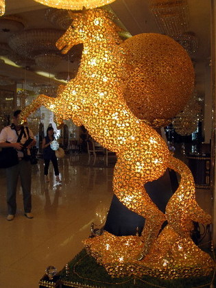 As the lighting capital of China, Guzhen's stores sell a variety of lights, from crystal chandeliers to the horse decoration pictured above. The horse, with a price tag of 58,800 yuan, is a small purchase in comparison to some of the lights, which can cost up to 400,000 yuan. [Susan Tart/China.org.cn]