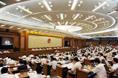 Photo taken on Aug. 24, 2009 shows the first plenary session of the 10th meeting of the Standing Committee of the 11th National People's Congress (NPC), the top legislature, held in Beijing, capital of China. [Xinhua]