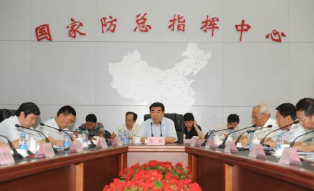 Chinese Vice Premier Hui Liangyu (C) addresses a meeting held by the State Flood Control and Drought Relief Headquarters in Beijing, capital of China, on Aug. 24, 2009, calling for greater efforts to fight floods and droughts.