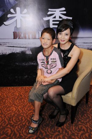 Actress Tao Hong (R) and young actor Yang Qing attend a party held before their leaving for the Montreal International Film Festival with the film 'Death Dowry', in Beijing, China, Aug. 24, 2009.