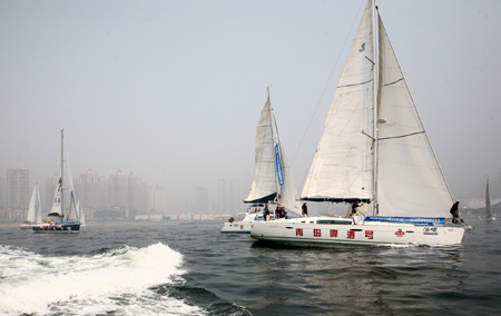 Sailors set off from Xinghai Bay during the Mayor Cup Dalian to Qingdao Sailing Rally in Dalian, a coastal city of northeast China's Liaoning Province, Aug. 25, 2009. The Mayor Cup Dalian to Qingdao Sailing Rally kicked off on Tuesday during which 8 sailing boats would travel through the Yellow Sea and pass Bohai Bay to reach Qingdao (east China's Shandong Province). It is estimated that they will arrive in Qingdao on Friday. 