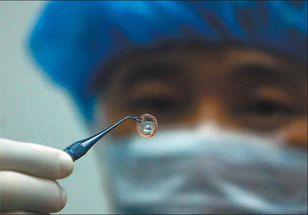 A cornea for transplant is collected from a deceased organ donor in Badong Hospital, Hubei province, in this file photo.