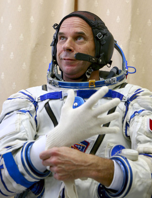 Guy Laliberte prepares for exercises during a training session in the International Space Station (ISS) at the Star City space centre outside Moscow, August 25, 2009. The Canadian billionaire, also owner of Cirque du Soleil, is on the countdown to become the world's seventh, and Canada's first space tourist slated to travel on a Russian Soyuz space craft to the ISS in September.[Xinhua/Reuters]