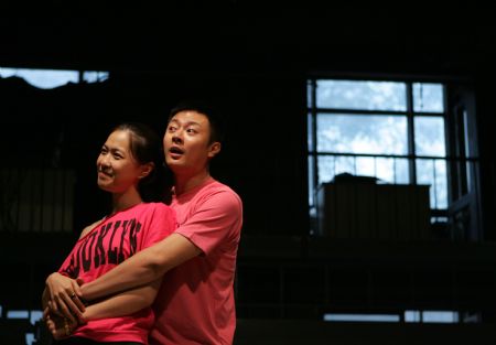 Actors perform during a rehearsal of 'Sunken Man of the City' in Beijing Aug. 25. 'Sunken Man of the City' is a modern drama adapted from the famous comedy 'Boeing Boeing' by French playwright Marc Camoletti.