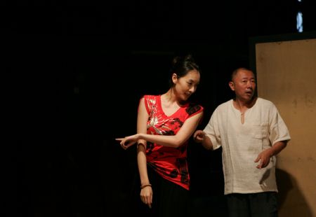 Actors perform during a rehearsal of 'Sunken Man of the City' in Beijing, Aug. 25. 