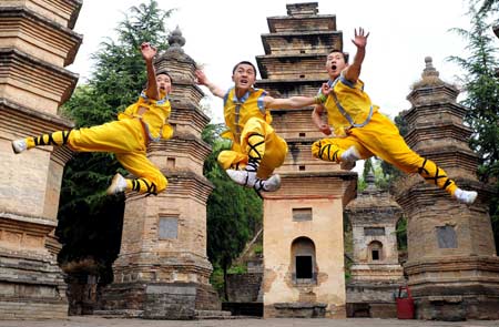 Students of the kungfu school perform renowned shaolin kungfu (martial art) at the Shaolin Temple in Dengfeng, central China's Henan Province, April 23, 2008. The 1500-year-old Shaolin Temple is regarded as the birthplace of Chinese kungfu. Its rich history and culture and extraordinary kungfu performance attract numerous tourists from home and abroad every year. [Xinhua File Photo]