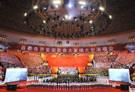 A vocal concert featuring patriotic songs is held in Beijing, China, on Aug. 26, 2009. Representatives from all walks of life in Beijing attended the large-scale concert on Wednesday.[Xinhua]