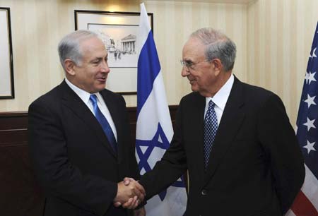 Israel's Prime Minister Benjamin Netanyahu (L) shakes hands with U.S. Middle East envoy George Mitchell during their meeting in London August 26, 2009, in this picture released by the Israeli Government Press Office (GPO). Netanyahu said on Wednesday his government was making progress towards reopening talks with the Palestinians and hoped to be able to do so shortly.