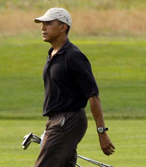 U.S. President Barack Obama walks up a fairway on the back nine during a round of golf at the Farm Neck golf course in Oak Bluffs, Massachusetts on the Island of Martha's Vineyard August 24, 2009. 