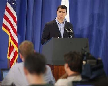 Deputy White House Press Secretary Bill Burton conducts the daily press briefing of media at a makeshift filing center in the gym at the Oak Bluffs School in Oak Bluffs, Mass., Monday, Aug. 24, 2009. [Stephan Savoia/AP Photo] 