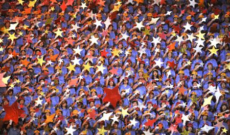 Participants perform a patriotic song in Beijing, China, on Aug. 26, 2009. 