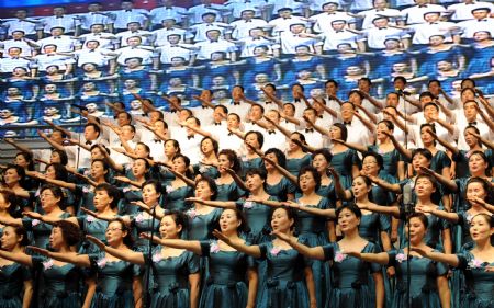 People perform during a celebration to greet the coming 60th anniversary of the founding of the People Republic of China in Urumqi, capital of northwest China's Xinjiang Uygur Autonomous Region on Aug. 27, 2009.(Xinhua/Wang 