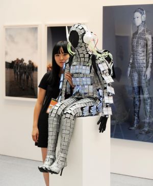 A Japan artist shows her work at Taipei World Trade Center in Taipei, southeast China&apos;s Taiwan Province, Aug. 27, 2009. The Art Taipei 2009, which attracts artists from countries and regions such as China, Japan, South Korea, Finland, and Poland, will open here on Friday. 