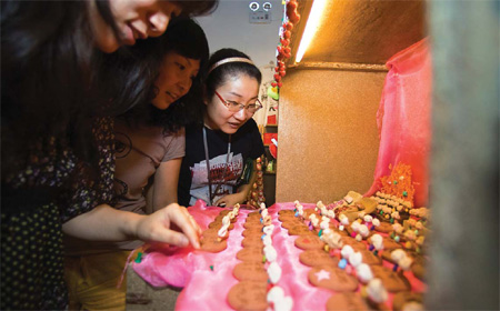 Customers walk from box to box at Fengguo Space, finding unique and creative gifts, arts and crafts. Fengguo Space gives independent Chinese artists a chance to showcase their products. 