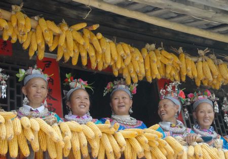 Villagers of the Miao ethnic group sing folk songs at the Chixin Festival, or New Grain Tasting Festival, in a village of the Miao ethnic group in Duyu City of southwest China's Guizhou Province, Aug. 28, 2009. (Xinhua/Qiao Qiming)