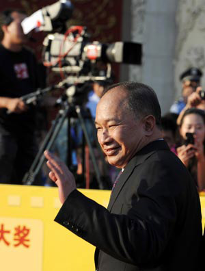 Director John Woo arrives for the 13th Huabiao Awards ceremony in Beijing, Aug. 29, 2009. The Huabiao Awards, also the governmental film prize, is known as one of the three most important domestic awards for Chinese films.