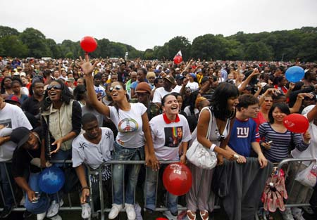 Fans celebrate the life of singer Michael Jackson during a concert by various disc jockeys remixing the King of Pop's music on what would have been his 51st birthday, in Brooklyn's Prospect Park, in New York, August 29, 2009.