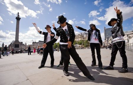 Michael Jackson fans dance the routine from 'Thriller' to celebrate the late-singer's 51st birthday in Trafalgar square in London August 29, 2009. Pop star Michael Jackson's death was ruled a homicide from drug overdose on Friday, fuelling speculation his personal physician, Dr. Conrad Murray, may soon be charged with manslaughter or another crime. Jackson would have turned 51 on Saturday.