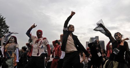 Michael Jackson's fans dance 'Thriller' in celebration of the late singer's 51st birthday in Mexico City, Mexico, on Aug. 29, 2009.