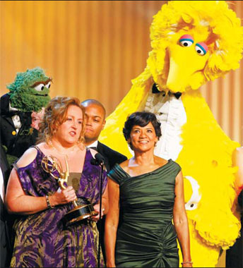 Sesame Street executive producer Carol-Lynn Parente (left) accepts the show's lifetime achievement award as characters Big Bird (right) look on at the 36th Annual Daytime Emmy Awards at the Orpheum Theatre in Los Angeles, on Sunday. 