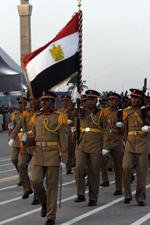 Honour guards march during a military parade in Tripoli, capital of Libya, on Sept. 1, 2009 to mark the 40th anniversary of Libyan Revolution, which brought leader Muammar Ghaddafi to power in 1969. (Xinhua/Hamza Turkia)