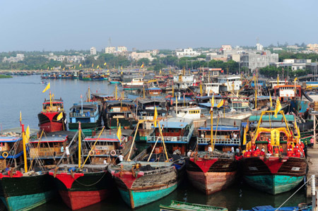 Decorated ships are seen during a sacrifice ceremony in Tanmen Harbor in Qionghai City of south China's Hainan Province, Sep. 1, 2009. (Xinhua/Meng Zhongde)