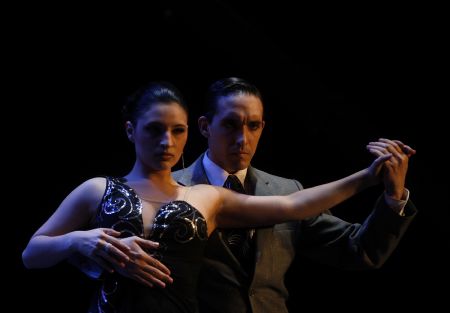 Jonathan Spitel (R) and Bethsabeth Flores of Argentina, representing the city of Cordoba, perform during the final round stage category of Argentina's seventh edition of the Tango Dance World Championship in Buenos Aires, August 31, 2009.