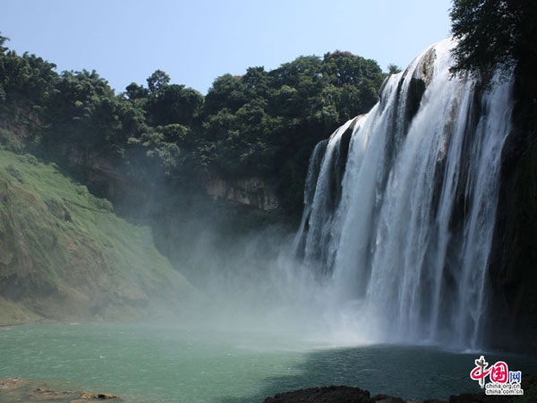 The Huangguoshu waterfall, the largest and one of the six most beautiful waterfalls in China, is located on the Baishui River in the Bouyei Miao ethnic minority Autonomous County, southwest China's Guizhou Province. The Huangguoshu waterfall runs down through plenty of rocks and is surrounded by steep mountains. The waterfall is 30 meters wide (can reach 40 meters in summer) and has a fall of 66 metres.