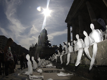 Ice sculptures in the shape of humans are placed on the steps of the music hall in Gendarmenmarkt public square in Berlin September 2, 2009. Hosted by the German World Wide Fund for Nature (WWF), 1,000 ice sculptures made by Brazilian artist Nele Azevedo were positioned on the steps in the German capital at noon, to highlight climate change in the arctic region.[