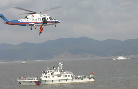 China's maritime rescue services staged their biggest ever exercise in the East China Sea Friday to test the country's maritime rescue capabilities and security for the Shanghai World Expo in 2010. [Xinhua]
