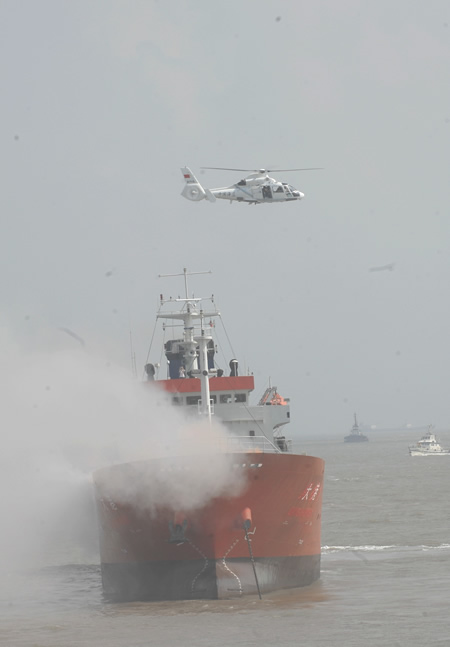 China's maritime rescue services staged their biggest ever exercise in the East China Sea Friday to test the country's maritime rescue capabilities and security for the Shanghai World Expo in 2010. [Xinhua]