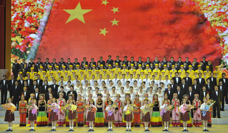 People perform a patriotic song during a vocal concert in Beijing, China, Sept. 4, 2009.(Xinhua