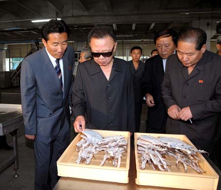 Photo released by Korean Central News Agency (KCNA) on Sept. 4, 2009 shows Kim Jong Il (2nd L), top leader of the Democratic People's Republic of Korea (DPRK), inspects the kimch'aek Taehung marine products company in north hamgyong-do, DPRK. (Xinhua/KCNA) 