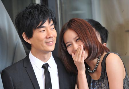 Actress Han Yuqin (R) talks with actor Richie Jen during the presentation of the film 'Yi Ngoy' (Accident) during the 66th Venice International Film Festival at Venice Lido, on September 5, 2009.