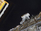 Discovery astronauts go on spacewalk