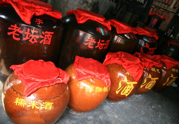 The photo taken on September 3, 2009, shows wines on sale in the Fenghuang Ancient Town in China's Hunan Province. [Photo: CRIENGLISH.com]
