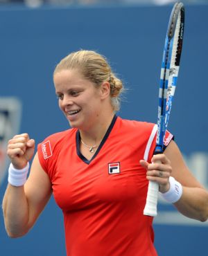 Kim Clijsters of Belgium celebrates her victory over Li Na of China during the women's singles quarterfinals at the U.S. Open tennis tournament in New York, the U.S., Sept. 8, 2009. Kim Clijsters won the match 2-0. (Xinhua/Shen Hong)