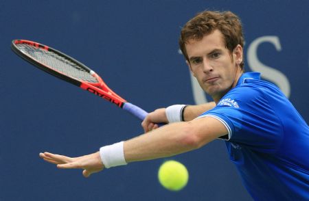 Andy Murray of Britain hits a return shot to Marin Cilic of Croatia during their match at the U.S. Open tennis championship in New York, September 8, 2009.