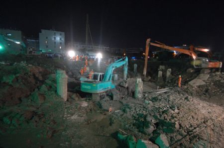 Photo taken on Sept. 9, 2009 shows the accident spot at a construction site in Taizhou City, east China's Zhejiang Province. A huge slurry pool at a construction site in Taizhou collapsed on Wednesday, causing at least seven people dead. Rescuers are still clearing the site.(Xinhua