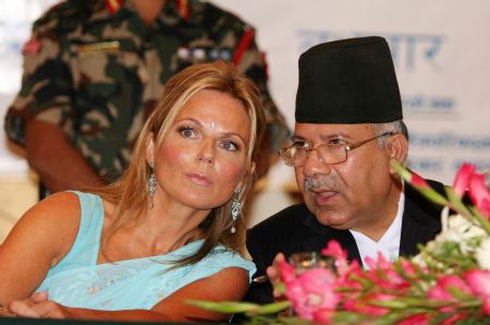 Former Spice Girl Geri Halliwell (L) talks with Nepal's Prime Minister Madhav Kumar Nepal at a luncheon organized by the Prime Minister's office in Kathmandu, capital of Nepal, Sept. 9, 2009. Halliwell, a Goodwill Ambassador of the United Nations Population Fund (UNFPA), is in Nepal to highlight the improvement of maternal health.[Xinhua]