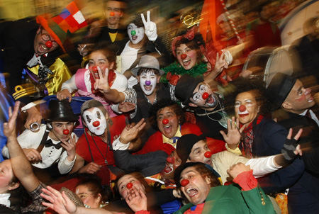 Clowns take part in a clown festival in Valparaiso City, about 75 miles (121 km) northwest of Santiago, September 7, 2009. Clowns from Brazil, Argentina and Spain took part in the festival.[Xinhua/Reuters]