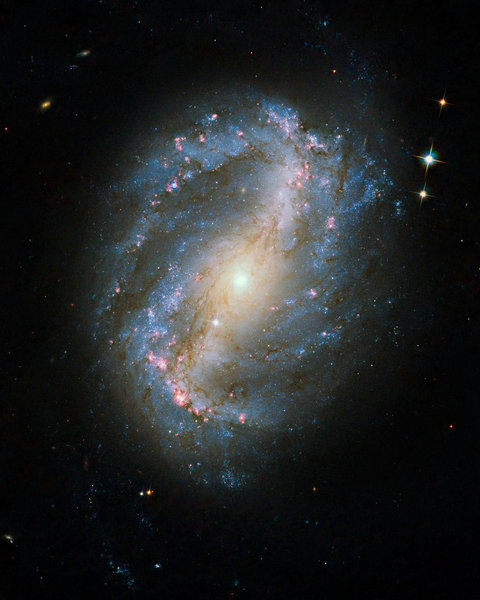 This image of barred spiral galaxy NGC 6217 is the first image of a celestial object taken with the newly repaired Advanced Camera for Surveys (ACS) aboard the Hubble Space Telescope. The camera was restored to operation during the STS-125 servicing mission in May to upgrade Hubble. [CFP]