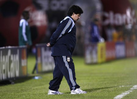 Argentina's coach Diego Maradona stands on the sidelines during their World Cup 2010 qualifying soccer match against Paraguay in Asuncion September 9, 2009.(Xinhua/Reuters Photo) 