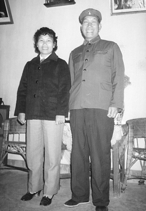 A couple wearing four-pocket military uniforms in the 1970s